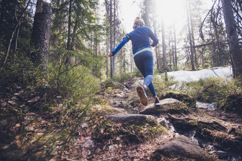 Woman running in the forest