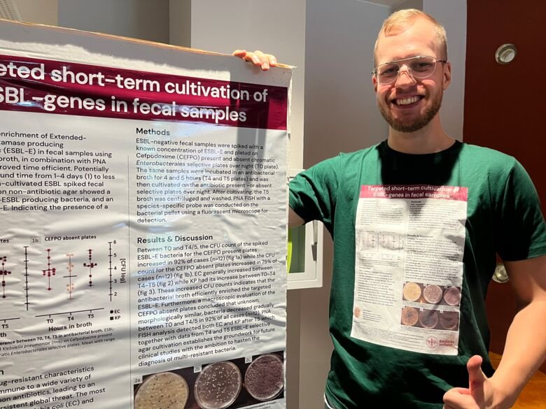 A picture of student Anton Holmgren defending his poster