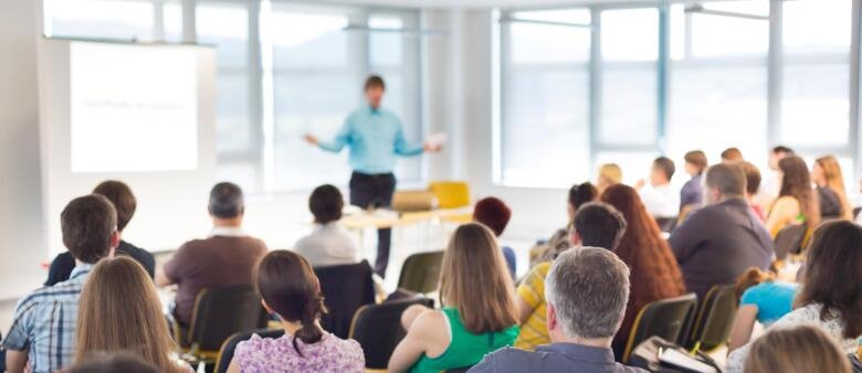 Group of people listening to a lecture