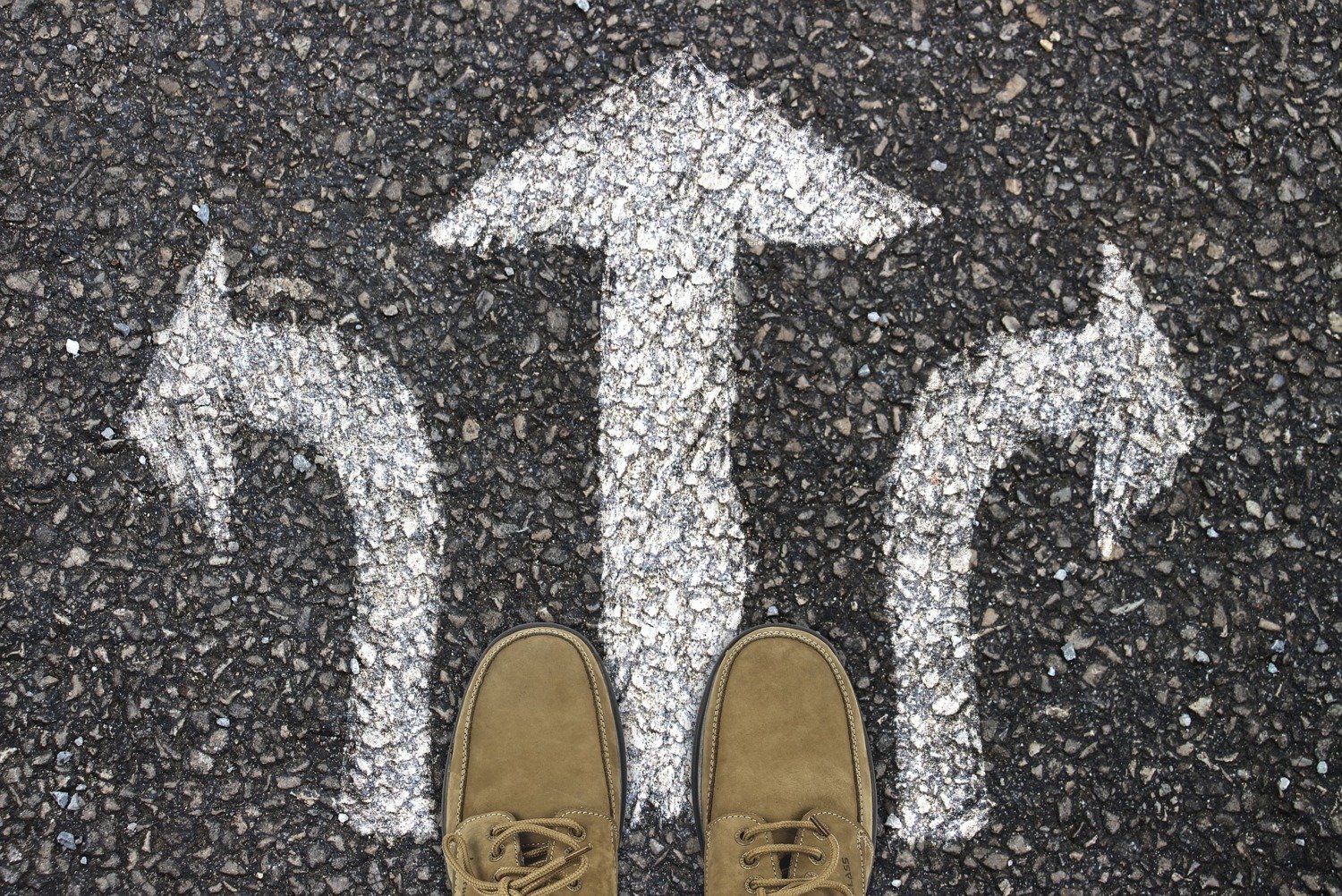 shoes on street with arrows