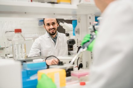 Researcher looking at colleague